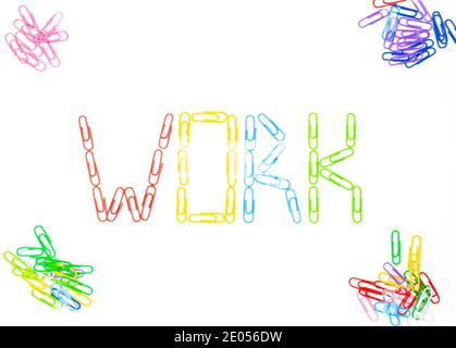 Word work.Made of colored bright paper clips on white background,top view.Close up Stock Photo