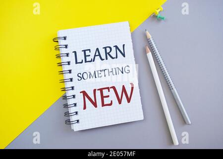 Conceptual hand writing showing Learn Something New. Business photo showcasing being taught new subject activity Knowledge or sport Stock Photo