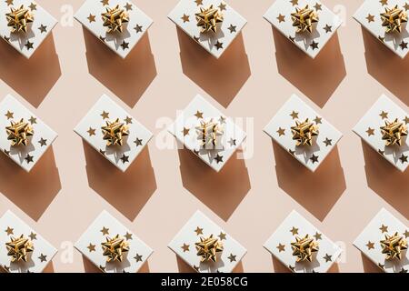 Pattern a lot of gift boxes on a pink background. New Year or Christmas background or holiday concept. Stock Photo