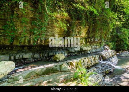 Textures of various stone layers in mountain river Stock Photo