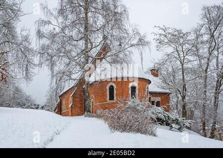 Marianske Lazne, Czech Republic - December 29 2020: Winter view of the Anglican church built in 1879 in Romano-Gothic style, made of red bricks. Stock Photo