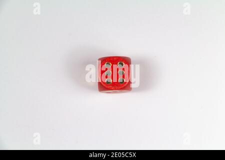 Red dice on number six on white background Stock Photo
