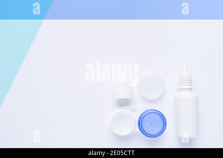 contact lens case on white and blue background, with copy space. Stock Photo