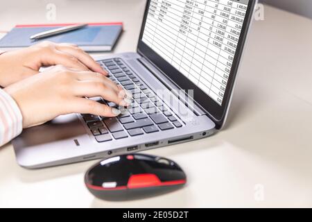 Working on a spreadsheet in the office Stock Photo