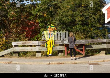 Pumpkin man tipping he's hat to a lady Stock Photo