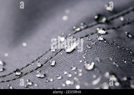 waterproof fabric - closeup of water resistant textile with water drops Stock Photo