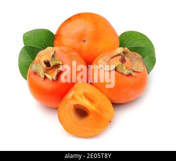 Persimmon with leaves isolated on white backgrounds. Stock Photo