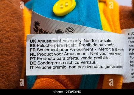 label on Super Monkey Ball soft plush toy - UK Amusement prize only not for re-sale in many different languages multi-languages Stock Photo