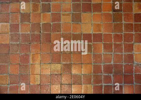Texture of an old red square tile Stock Photo