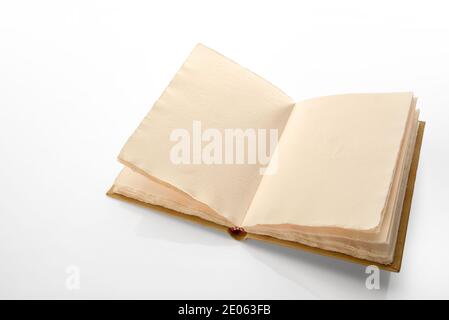 Open antique style book with pages of rough paper with jagged edges, vintage leather hardcover notebook isolated on white background Stock Photo