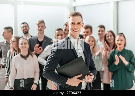 young project Manager standing in front of the working group Stock Photo