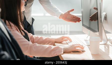 working group works on computers in the office Stock Photo