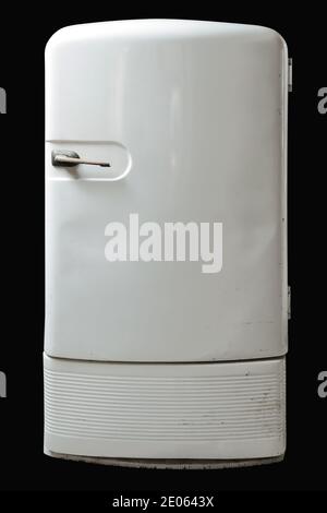 Retro refrigerator isolated on black background. Stock Photo
