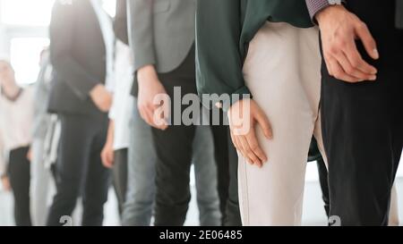 image of young business people standing in a long queue Stock Photo