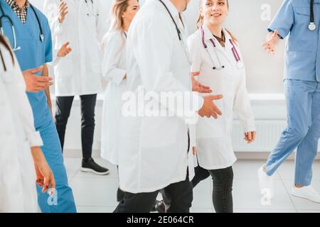 group of medical doctors discussing something on the go Stock Photo