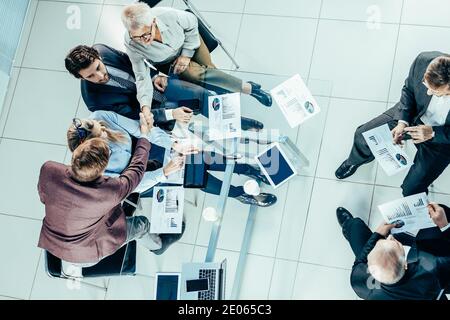 top view. the working group is working on the financial report. Stock Photo