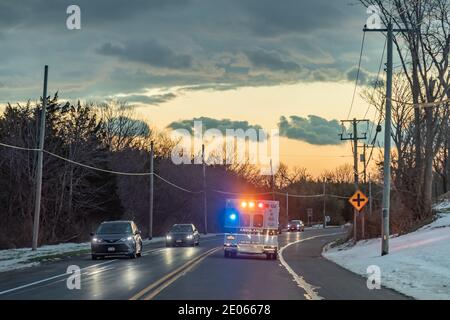 East Hampton Ambulance on an emergency run with lights and siren on Stock Photo