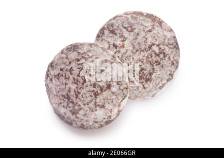 Studio shot of chocolate and marzipan biscuits cut out against a white background - John Gollop Stock Photo