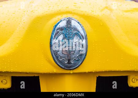 Badge on the front of an antique yellow Fordson Major Industrial tractor at a vintage tractor rally in North East England Stock Photo