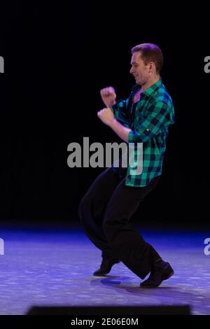 Actor dancer young man performs in the theater on stage in a dance ...