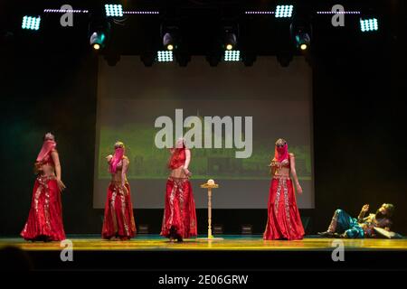 Dancers actors in Oriental Bellydance costumes perform in theater on ...