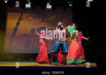 Dancers actors in Oriental Bellydance costumes perform in theater on ...