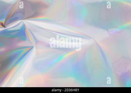 Rainbow halographic wrinkled foil background. Abstract pastel color background. Stock Photo