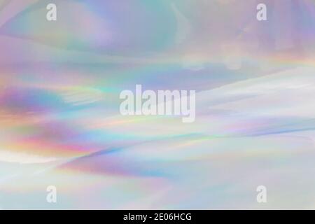 Rainbow halographic wrinkled foil background. Abstract pastel color background. Stock Photo