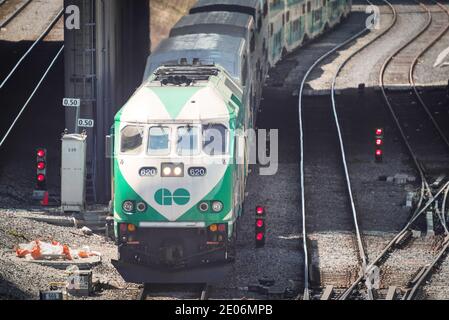 GO Transit train riding on a bright day. GO Transit is a regional public transit system in Southern Ontario, Canada, serving the Golden Horseshoe regi Stock Photo