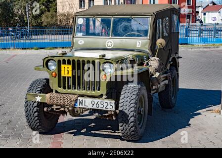 Legionowo, Poland - April 11, 2020: Willys MB, jeep - military American personal off-road car from World War II. Green car with a fabric roof. Stock Photo