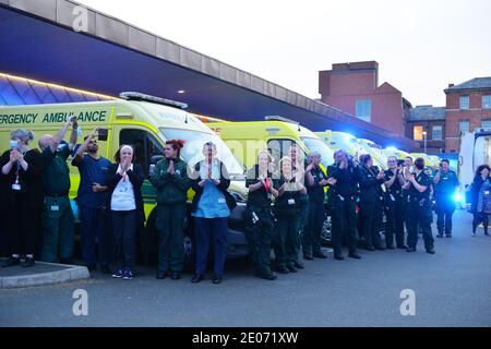 Emergency Service workers from Leicester gather at Leicester Royal Infirmary to applaud the NHS staff during clap for carers Stock Photo