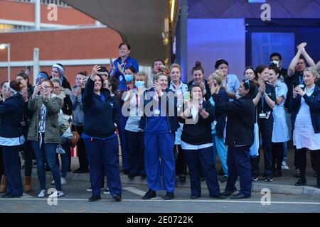 Emergency Service workers from Leicester gather at Leicester Royal Infirmary to applaud the NHS staff during clap for carers Stock Photo