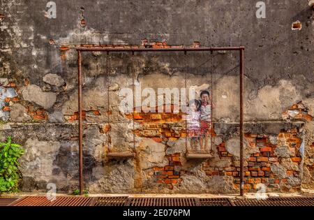 Streetart by Ernest Zacharevic in Penang, Malaysia Stock Photo