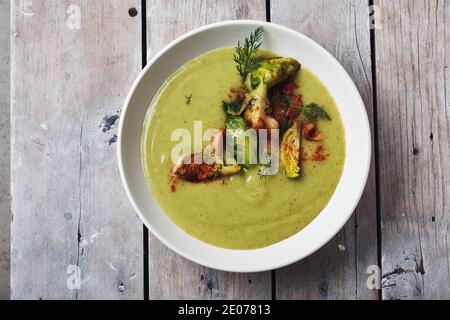 Green vegetable cream soup with broccoli and brussels sprouts. Stock Photo