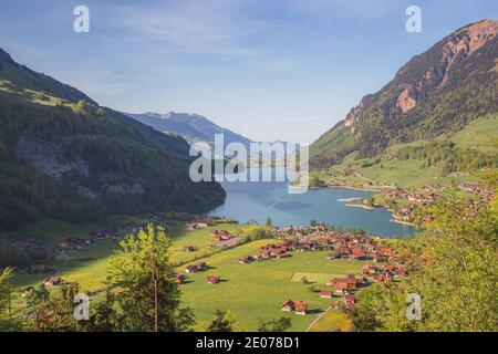 A view over the beautiful Lake Lungern (Lungerersee) on a clear sunny day taken from Schoenbuehel viewing point. Stock Photo