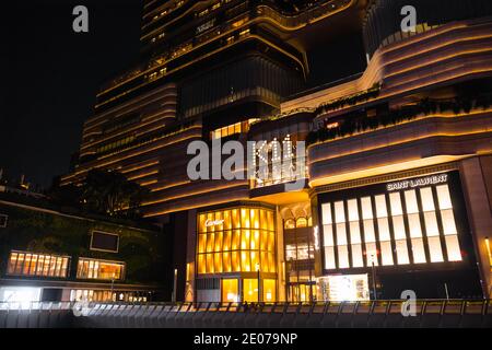 K11 Musea entrance by night. Retail & arts complex and shopping centre (New World Development). Victoria Dockside, Tsim Sha Tsui promenade (Kowloon). Stock Photo