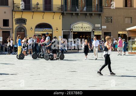 Tourist group on segways in Piazza della Signoria, Florence, Italy Stock Photo