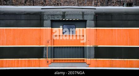 Vintage and abandoned empty railroad train car on the train tracks Stock Photo