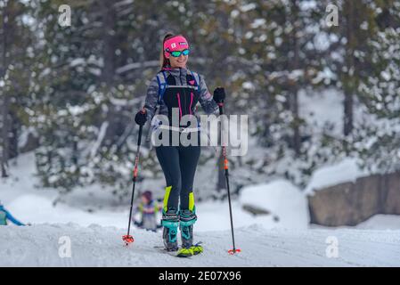 Grandvalira, Andorra : 2020 December 27 : Woman doing Ski Mountaineering in the mountains in the Pyrenees in Europe in winter 2020. Stock Photo