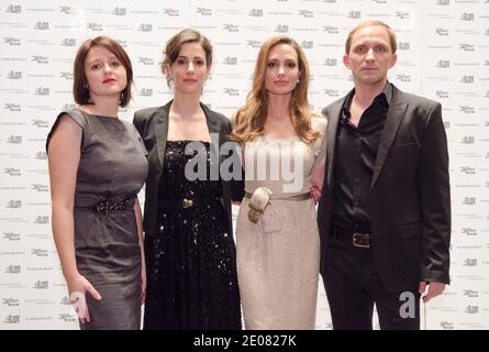 Vanessa Glodjo, Zana Marjanovic, Angelina Jolie, and Goran Kostic, pose for a photo during the 'In The Land of Blood and Honey' D.C. Premiere at the United States Holocaust Memorial Museum in Washington DC, USA on January 10, 2012. Photo by Kris Connor/ABACAUSA.COM. Stock Photo