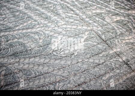 Abstract winter pattern of ice on glass. Winter ice patterns on window. Stock Photo