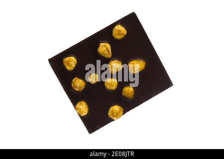 Dark chocolate with whole carmelized hazelnuts isolated on  white background Stock Photo