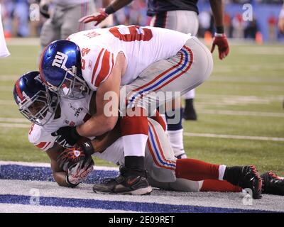 Running back Ahmad Bradshaw (44) of the New York Giants is congratulated by center David Baas (64) of the New York Giants after scoring a second-half touchdown against the New England Patriots in Superbowl XLVI at Lucas Oil Stadium in Indianapolis, Indiana, USA on February 05, 2012. Photo by Lionel Hahn/ABACAPRESS.COM Stock Photo