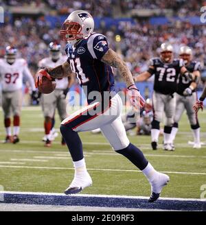 Tight end Aaron Hernandez (81) of the New England Patriots celebrates his  touchdown against the New York Giants on the opening drive of the second  half in Super Bowl XLVI at Lucas