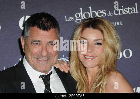 Jean-Marie Bigard and his wife Lola Marois posing in the press room at the 7th 'Globes de Cristal' awards held at Le Lido in Paris, France, on February 6, 2012. Photo by Mireille Ampilhac/ABACAPRESS.COM Stock Photo