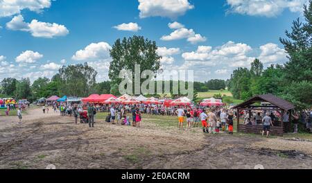 Cedynia, Poland, June 2019 Crowd of tourists or spectators watching medieval warrior tournament at historical reenactment of Battle of Cedynia Stock Photo