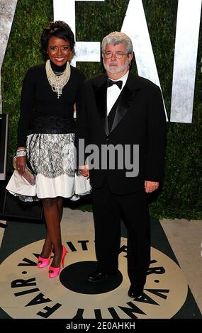 George Lucas and Melanie Hobbson arriving at the 2012 Vanity Fair Oscar Party, hosted by Graydon Carter, held at the Sunset Tower Hotel in Los Angeles, CA on February 26, 2012. Photo by Vince Bucci/ABACAPRESS.COM Stock Photo