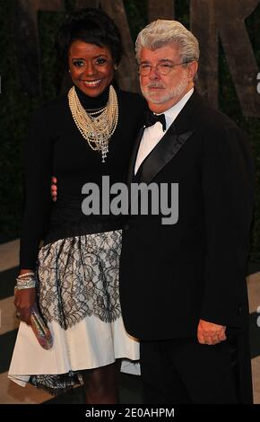 George Lucas and Melanie Hobbson arriving at the 2012 Vanity Fair Oscar Party, hosted by Graydon Carter, held at the Sunset Tower Hotel in Los Angeles, CA on February 26, 2012. Photo by Vince Bucci/ABACAPRESS.COM Stock Photo