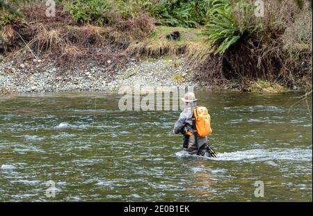 Man in hip waders salmon fishing on the Miramichi River in New Brunswick  Canada Stock Photo - Alamy