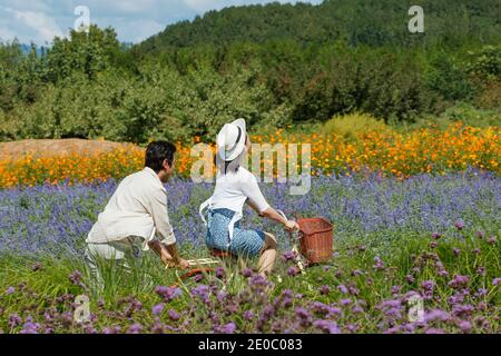 Young couples in the suburbs to ride a bicycle Stock Photo